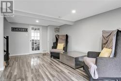 Sitting room featuring light wood-type flooring - 