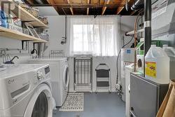 Laundry room with washing machine and dryer and water heater - 