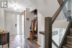 Entryway with a barn door and dark hardwood / wood-style flooring - 