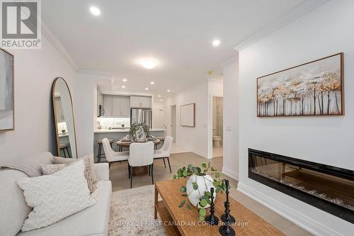 214 - 1560 Upper West Avenue, London, ON - Indoor Photo Showing Living Room With Fireplace