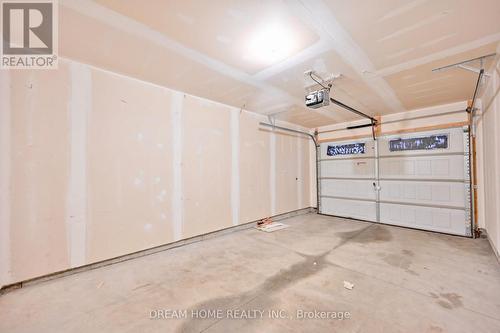 10 - 66 Eastview Road, Guelph, ON - Indoor Photo Showing Garage