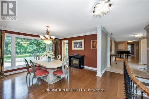 105 Locharron Crescent, Ottawa, ON - Indoor Photo Showing Dining Room With Fireplace