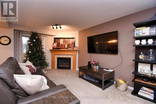 8 - 18 Cedar Street, Grimsby, ON - Indoor Photo Showing Living Room With Fireplace