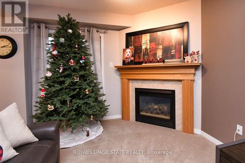 8 - 18 Cedar Street, Grimsby, ON - Indoor Photo Showing Living Room With Fireplace