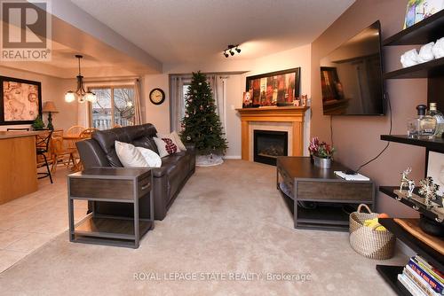 8 - 18 Cedar Street, Grimsby, ON - Indoor Photo Showing Living Room With Fireplace