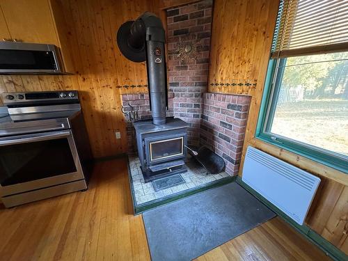 Kitchen - 153 Rue Marleau, Denholm, QC - Indoor With Fireplace