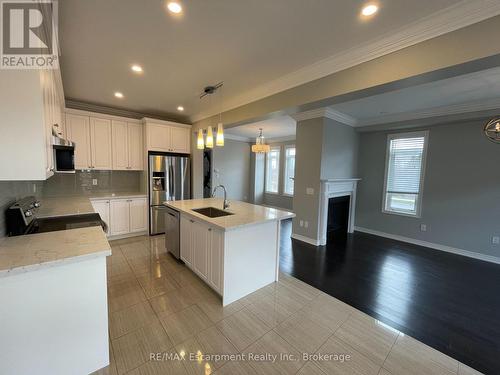 563 Stream Crescent, Oakville, ON - Indoor Photo Showing Kitchen With Fireplace With Stainless Steel Kitchen