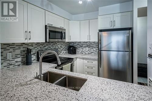 707 - 2177 Burnhamthorpe Road W, Mississauga, ON - Indoor Photo Showing Kitchen With Double Sink With Upgraded Kitchen