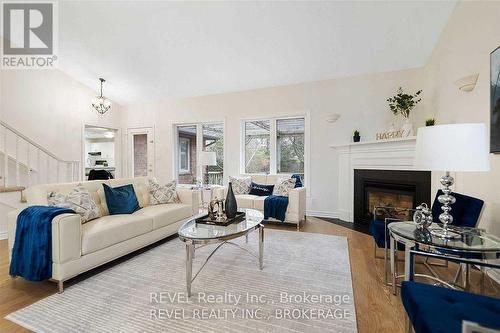 6839 Imperial Court, Niagara Falls, ON - Indoor Photo Showing Living Room With Fireplace