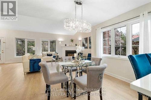 6839 Imperial Court, Niagara Falls, ON - Indoor Photo Showing Dining Room With Fireplace