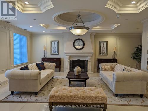 332 - 2300 Upper Middle Road W, Oakville, ON - Indoor Photo Showing Living Room With Fireplace