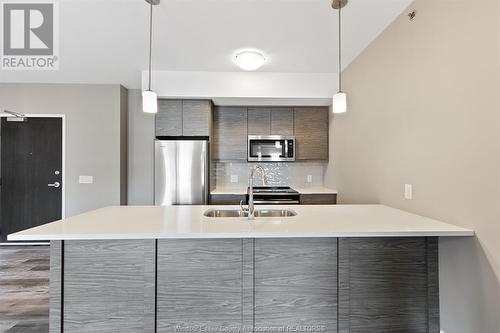 716 Brownstone Unit# 208, Tecumseh, ON - Indoor Photo Showing Kitchen With Stainless Steel Kitchen With Double Sink With Upgraded Kitchen