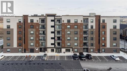 716 Brownstone Unit# 208, Tecumseh, ON - Outdoor With Balcony With Facade