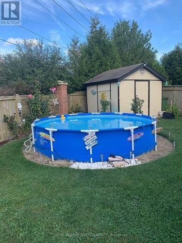 68 Meadowvale Drive, St. Thomas, ON - Outdoor With Above Ground Pool With Backyard