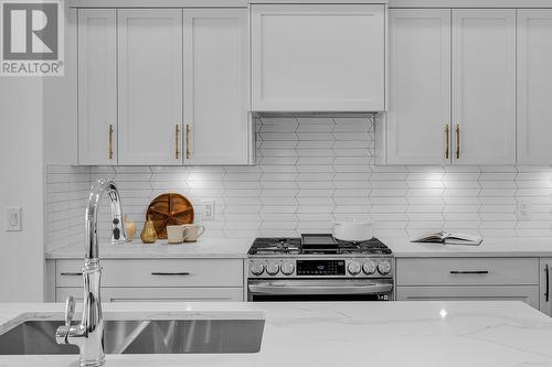 981 Lochness Street, Kelowna, BC - Indoor Photo Showing Kitchen With Double Sink With Upgraded Kitchen