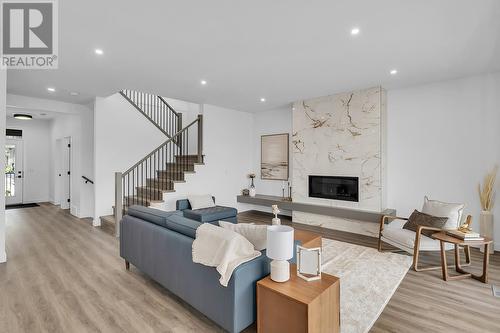 981 Lochness Street, Kelowna, BC - Indoor Photo Showing Living Room With Fireplace