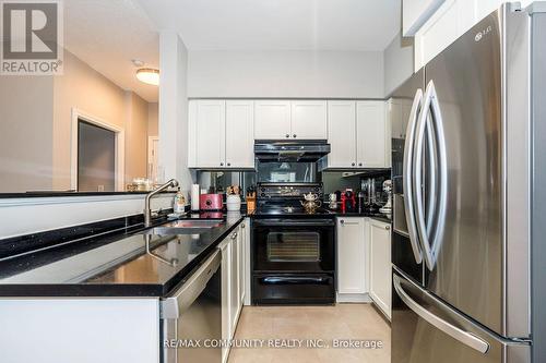 718 - 16 Dallimore Circle, Toronto, ON - Indoor Photo Showing Kitchen