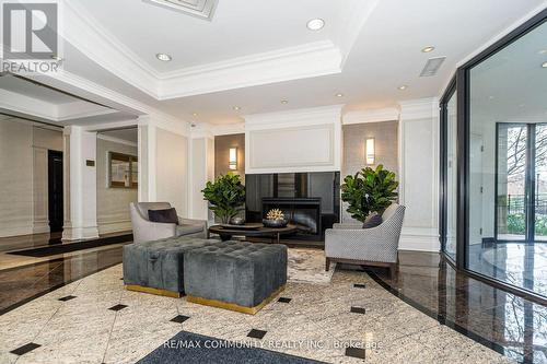 718 - 16 Dallimore Circle, Toronto, ON - Indoor With Fireplace