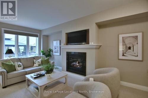 32 Sandy Coast Crescent, Wasaga Beach, ON - Indoor Photo Showing Living Room With Fireplace