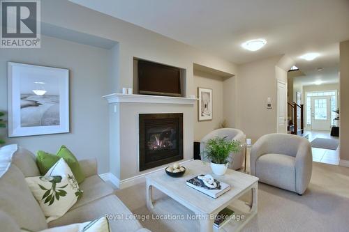 32 Sandy Coast Crescent, Wasaga Beach, ON - Indoor Photo Showing Living Room With Fireplace