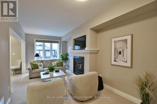 32 Sandy Coast Crescent, Wasaga Beach, ON - Indoor Photo Showing Living Room With Fireplace