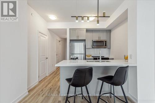 1001 - 450 Dundas Street E, Hamilton (Waterdown), ON - Indoor Photo Showing Kitchen With Upgraded Kitchen