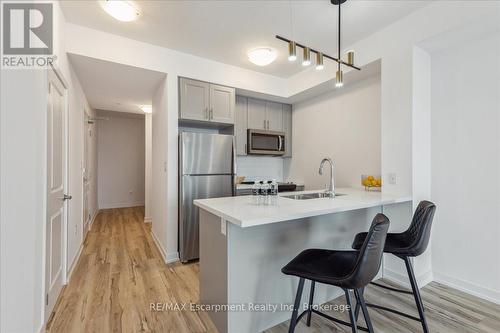 1001 - 450 Dundas Street E, Hamilton (Waterdown), ON - Indoor Photo Showing Kitchen With Stainless Steel Kitchen With Double Sink