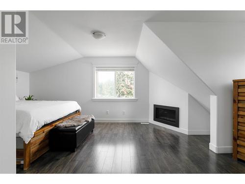 4641 Crawford Court, Kelowna, BC - Indoor Photo Showing Bedroom With Fireplace