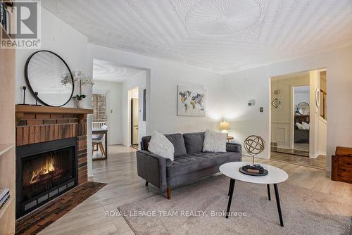 194 Barrow Crescent N, Ottawa, ON - Indoor Photo Showing Living Room With Fireplace