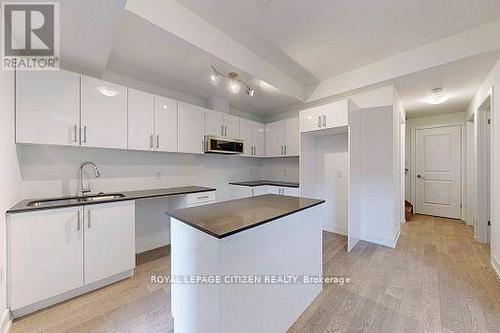 147 - 1075 Douglas Mccurdy Comm, Mississauga, ON - Indoor Photo Showing Kitchen With Double Sink