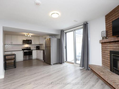 18 Wright St, Brampton, ON - Indoor Photo Showing Other Room With Fireplace