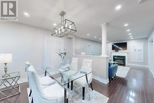 4 Sirius Crescent, Toronto, ON - Indoor Photo Showing Dining Room With Fireplace