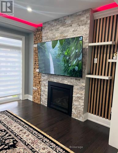 25 Christine Elliott Avenue, Whitby, ON - Indoor Photo Showing Living Room With Fireplace