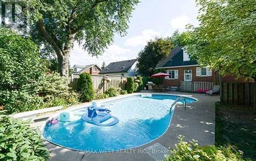 66 Mcmurchy Avenue N, Brampton, ON - Outdoor With In Ground Pool With Backyard