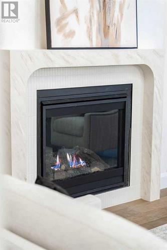 2040 56 Avenue Sw, Calgary, AB - Indoor Photo Showing Living Room With Fireplace