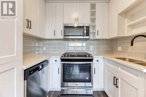 Kitchen Gas Range - 1308, 350 Livingston Common Ne, Calgary, AB - Indoor Photo Showing Kitchen