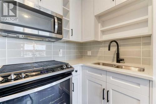 Kitchen - 1308, 350 Livingston Common Ne, Calgary, AB - Indoor Photo Showing Kitchen With Double Sink With Upgraded Kitchen