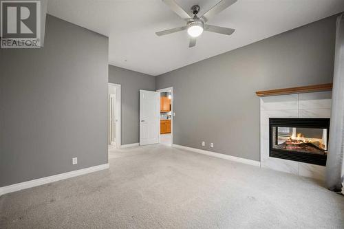 8201, 14 Hemlock Crescent Sw, Calgary, AB - Indoor With Fireplace