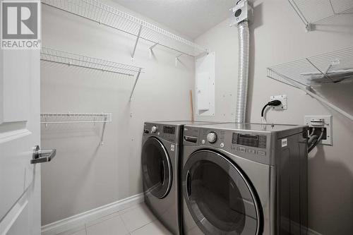 8201, 14 Hemlock Crescent Sw, Calgary, AB - Indoor Photo Showing Laundry Room