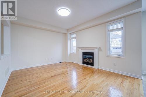 69 James Govan Drive, Whitby, ON - Indoor Photo Showing Living Room With Fireplace