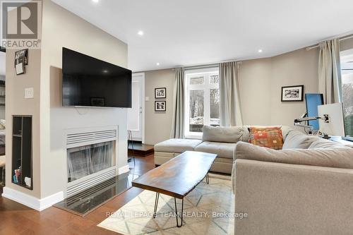 101C - 997 North River Road, Ottawa, ON - Indoor Photo Showing Living Room With Fireplace