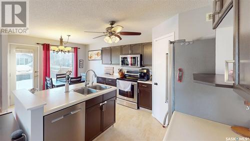 1607 Rousseau Crescent N, Regina, SK - Indoor Photo Showing Kitchen With Stainless Steel Kitchen With Double Sink