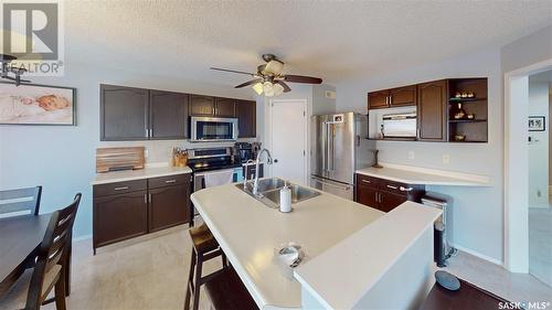 1607 Rousseau Crescent N, Regina, SK - Indoor Photo Showing Kitchen With Stainless Steel Kitchen With Double Sink