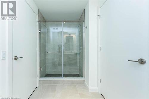 Bathroom with controlled heated porcelain floors and walk in shower - 741 King Street W Unit# 301, Kitchener, ON - Indoor Photo Showing Bathroom