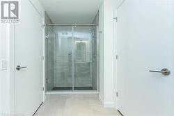 Bathroom with controlled heated porcelain floors and walk in shower - 