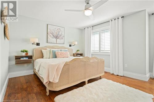 Bedroom featuring ceiling fan and dark hardwood / wood-style flooring - 659 Deervalley Road, Ancaster, ON - Indoor Photo Showing Bedroom