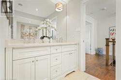 Bathroom featuring vanity and hardwood / wood-style flooring - 