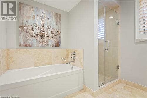 Bathroom with tile patterned flooring and independent shower and bath - 659 Deervalley Road, Ancaster, ON - Indoor Photo Showing Bathroom