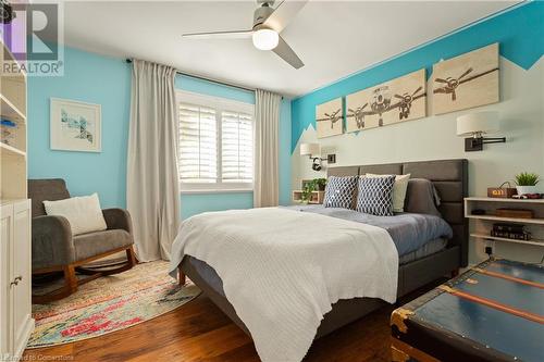 Bedroom featuring ceiling fan and dark hardwood / wood-style floors - 659 Deervalley Road, Ancaster, ON - Indoor Photo Showing Bedroom