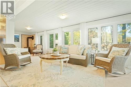 Sunroom with a wood stove and wood ceiling - 659 Deervalley Road, Ancaster, ON - Indoor Photo Showing Living Room